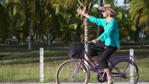 Slow motion side view portrait of pretty senior mature woman smiling wearing Stock Footage 233218304