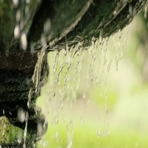 Slow Motion Side View Water Running Down Fountain Stock Footage 69562040