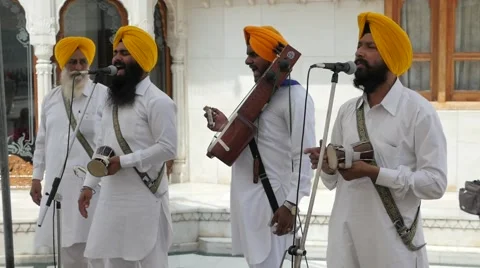 SLOW MOTION Sikh musicians in Golden Temple,Amritsar,India Stock Footage