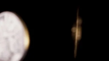 Slow motion silver and gold bitcoins colliding falling into black Stock Footage 85472796