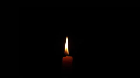 Slow-motion Single Candle Flame Isolated on Black Background. Candlelight gives  Video stock 141681591