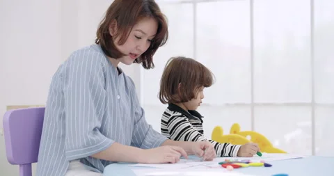 Slow motion single mother teaching kids at home, mom teaches color and shape, Stock Footage 341384074