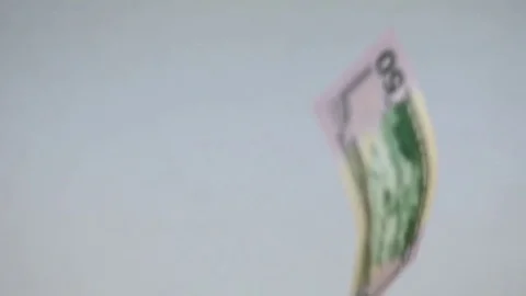 Slow Motion Single US Dollar Bills Falling Stock Footage 72814705
