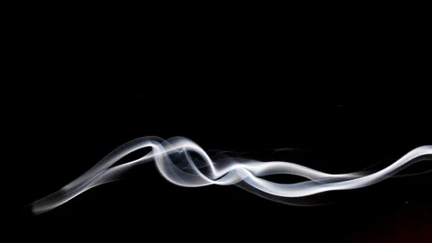 Slow motion of sinuous white smoke floating against a black background. 스톡 동영상 130021336