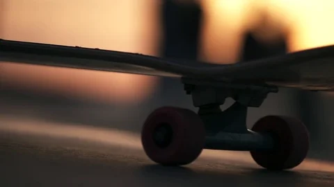 Slow Motion Skateboard Extreme Close Up At Sunset Stock Footage