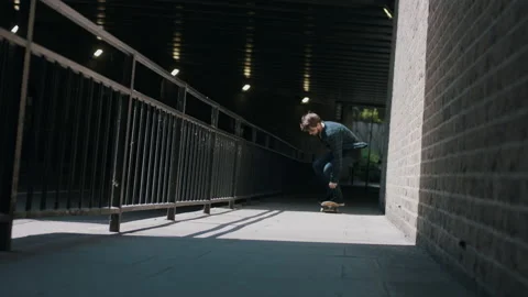 Slow Motion Of Skateboarder Doing A 360 flip  In The Empty Street Stock Footage 133621430