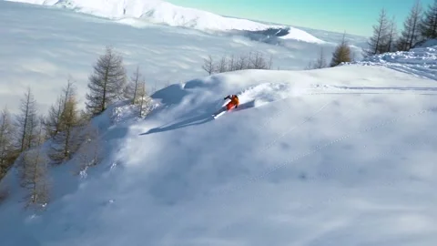 Slow motion skier carving through thick fresh powder snow. Skier on the mountain Stock Footage 150592691
