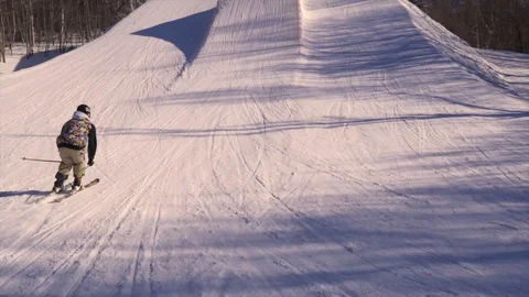 SLOW MOTION Skier does HUGE BACKFLIP on Jump in Terrain Park Stock Footage 129457527