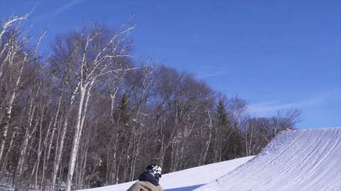 SLOW MOTION Skier does HUGE BACKFLIP off Jump Stock Footage 129457644