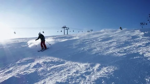 Slow motion: Skiers Skiing Down Slope at competition Forest Cross in sunny day Stock Footage 83144311