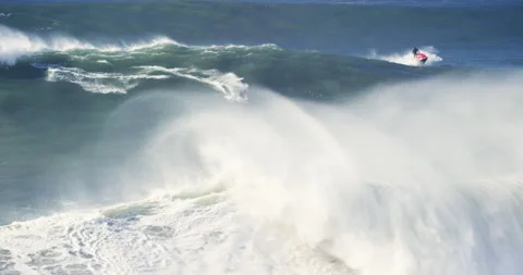 Slow motion of skilled professional surfer driving jet ski across ocean waves Stock Footage 155801186