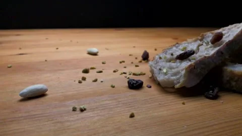 Slow motion of sliced bread falling on a table Stock Footage 131116327