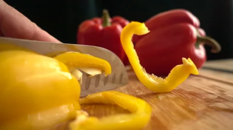 Slow motion slicing bell pepper Stock Footage 68672944