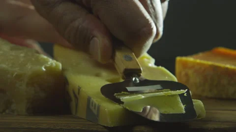 Slow motion slicing cheese Stock Footage 67358961