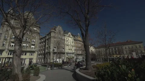 Slow Motion Slider Shot Through Historic Square and Urban Park in Budapest Stock Footage 336061724