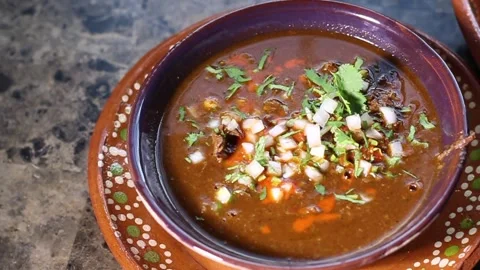 Slow motion slider of traditional beef birria dish. Mexican food Stock Footage 265296472
