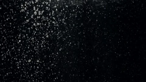 Slow motion small air bubbles in water rising up to surface on black background 스톡 동영상 168244882