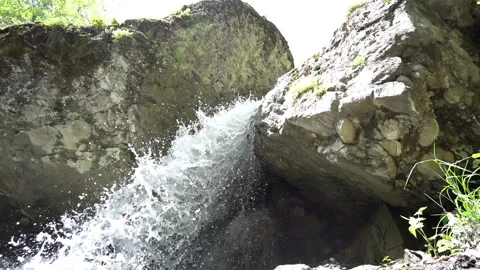 Slow Motion of Small Mountain Waterfall Video stock 308964206