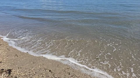 Slow motion small sea waves touching the sandy shore Stock Footage 319652234
