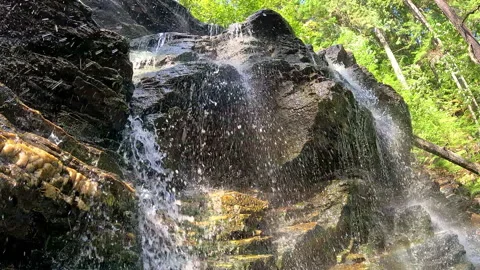 Slow motion of small water fall over rock ledge Stock Footage 252159961