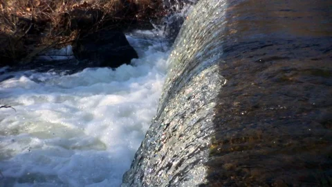 Slow motion small waterfall Stock Footage 100604174