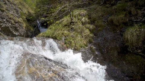 Slow motion of small waterfall in mountain stream in sunny spring nature Stock Footage 116894065