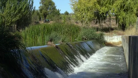 Slow motion of small waterfall with nobody around in summer time Stock Footage 146615668