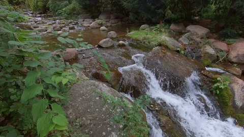 Slow Motion of A Small Waterfall With Rocks Stock Footage 116058184