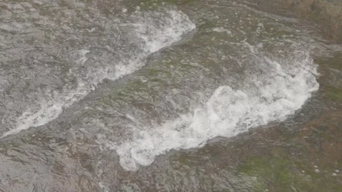 Slow Motion of Small Waterfall/Cascata Flowing Over Rocks in Paraty Stock Footage 320633587