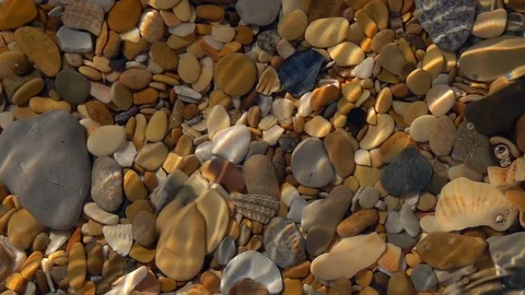 Slow motion of small waves from corner of frame on shallow pure water close up. Stock Footage 98095066