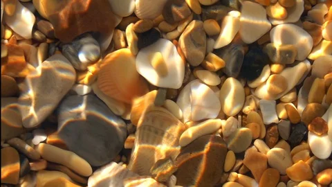 Slow motion of small waves with play of sun light in shallow pure water Stock Footage 98095116