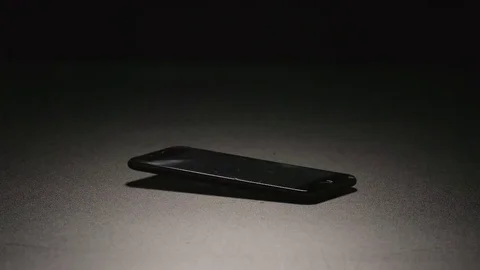 SLOW MOTION: Smartphone falls on a floor Stock Footage 72273404