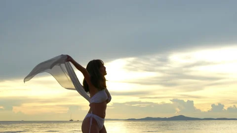 SLOW MOTION: Smiling attractive young asian woman bikini sexy on beach Video stock 199571283