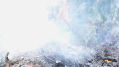 Slow motion smog and flame fire is burning garbage or waste  on dark background. Stock Footage 91319600