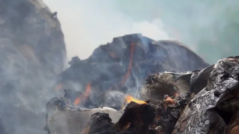 Slow motion smoke of fire burning garbage waste of plastic Stock Footage 93891927
