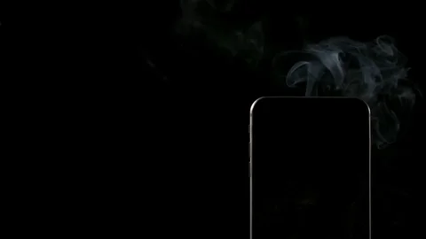 SLOW MOTION: Smoke from smartphone on a dark background - Right Vídeo Stock 72374483