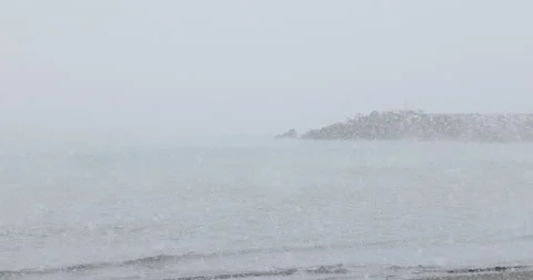 Slow motion snow covered beach and Eboshi rock in Japan Video stock 348206770