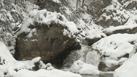 Slow motion snow fall over waterfall Stock Footage 85701198