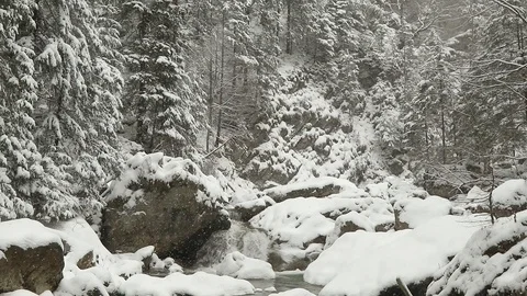 Slow motion snow fall over waterfall Stock Footage 85701217