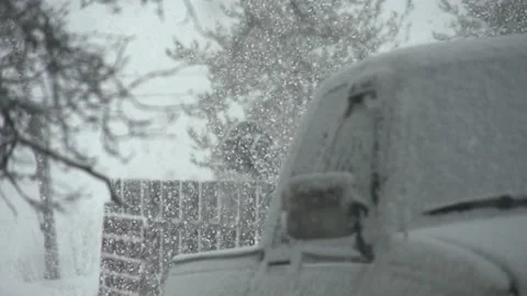 Slow motion snow falling  focus pull truck in foreground 240fps to 24 fs700 動画素材 220692668