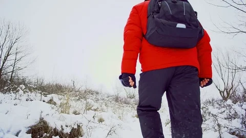Slow motion. snow winter landscape walk men whit backpack Stock Footage 72619441