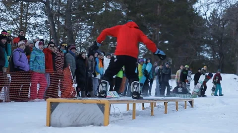 Slow motion: snowboarder jumping Stock Footage 52934654