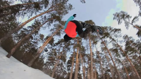Slow motion: snowboarder jumping Stock Footage 52935278