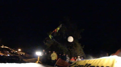 Slow motion: snowboarder jumping night Stock Footage 52932825