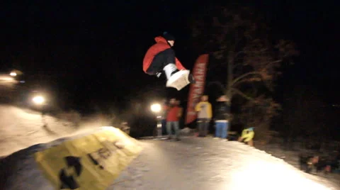 Slow motion: snowboarder jumping night Stock Footage 52932886
