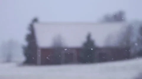 Slow motion snowfall in countryside. Old barn in background Stockbeeldmateriaal 33119847