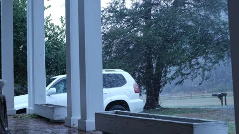 Slow motion snowfall Porch Front Yard SUV parked in winter_02 Video stock 325070883