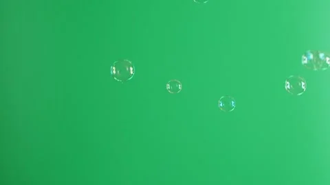 Slow motion of soap air bubbles texture on chroma key green screen background Video stock 182756095