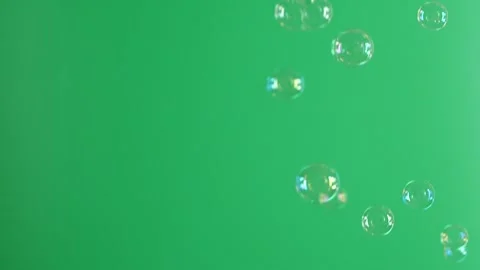 Slow motion of soap air bubbles texture on chroma key green screen background Video stock 243064035