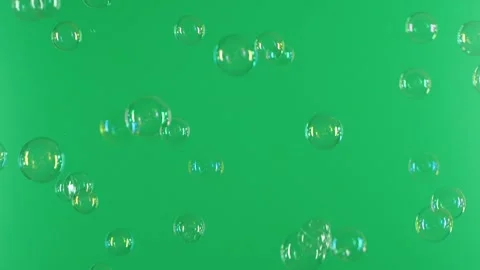 Slow motion of soap air bubbles texture on chroma key green screen background Video stock 248202657